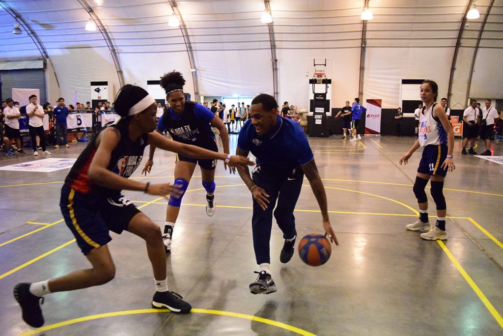 Denver Nuggets point guard Monte Morris plays an exhibition game with National University Lady Bulldogs.